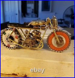Handmade Motorcycle made with watch parts and other materials. One of a kind